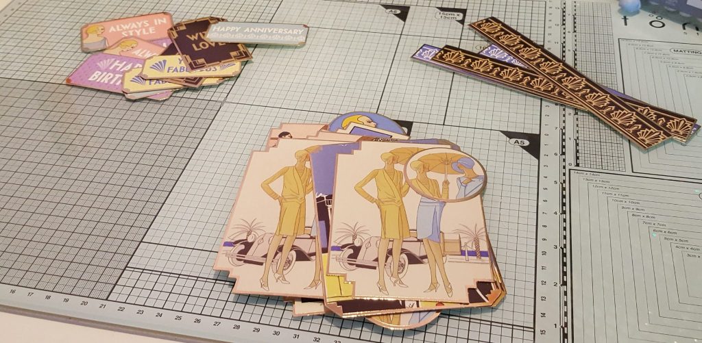 The art deco pieces popped out of the backing card.