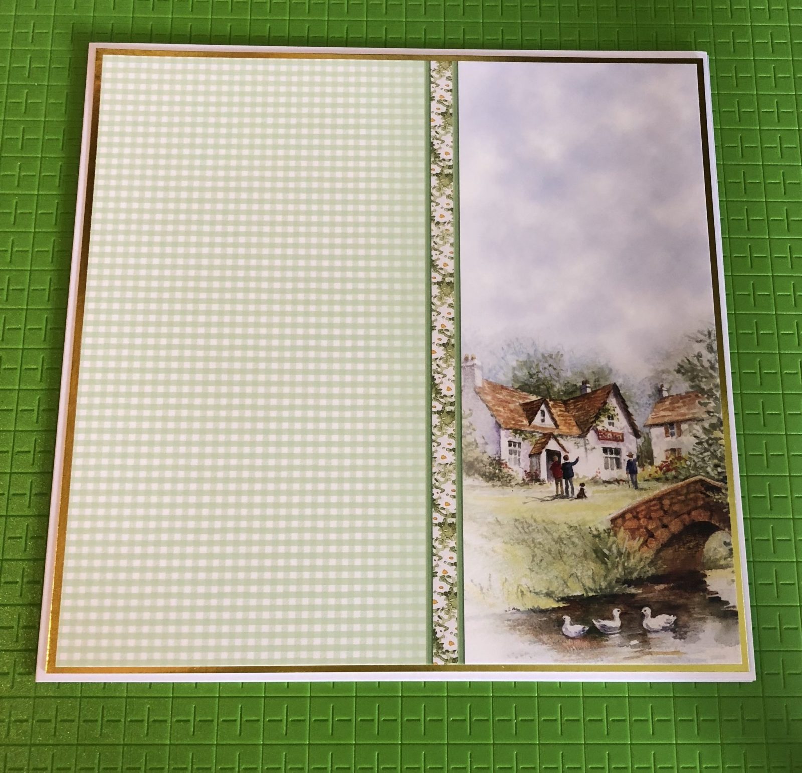 Card Base Layer Living Creatively with Fibro | Card Base Layer with the matching cardstock featuring a green gingham check panel and an image of a county cottage with a bridge over a stream and ducks floating by