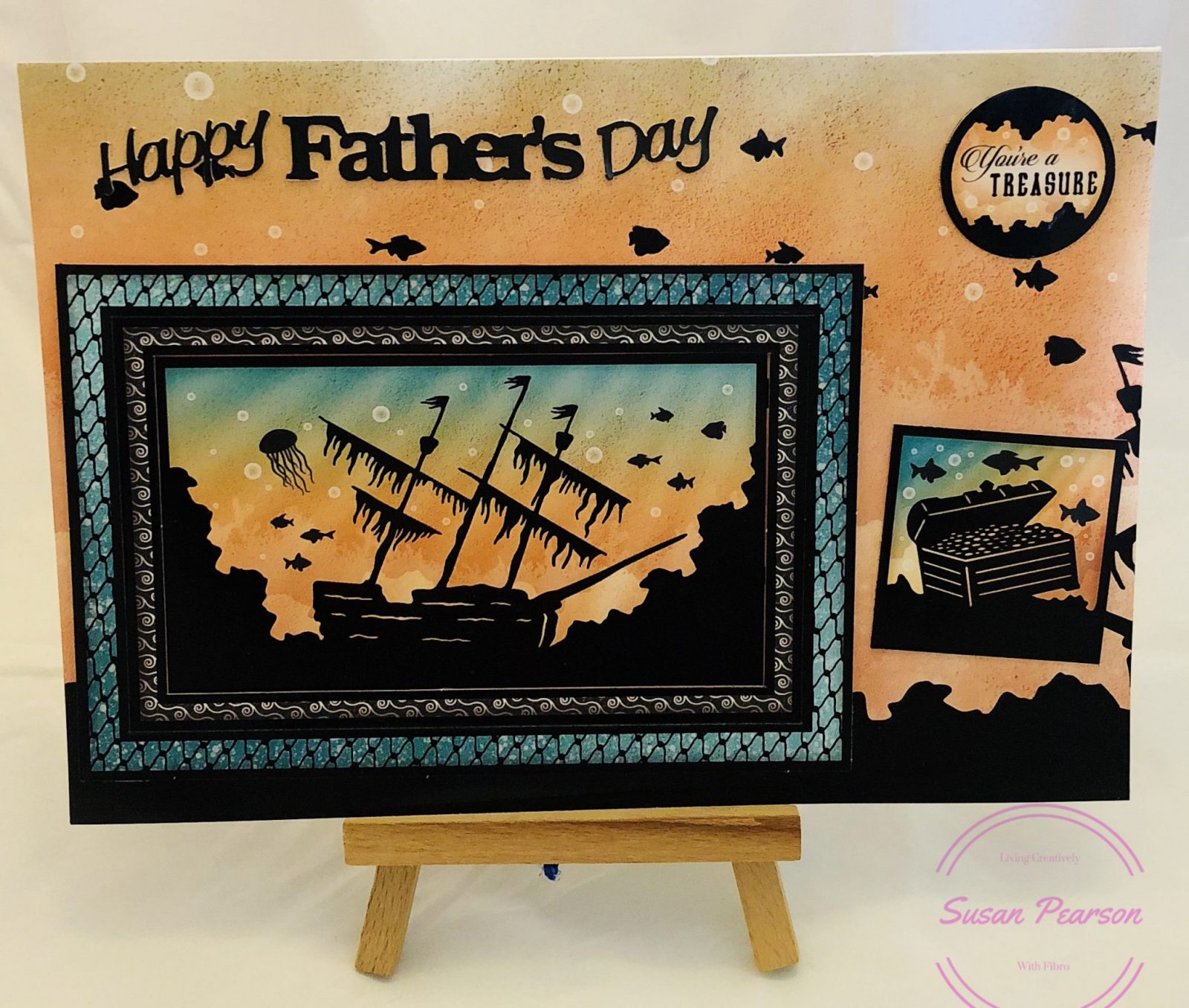 Father's Day 2018 card for Dad Living Creatively with Fibro | Father's Day 2018 card for Dad featuring a silhouette image of of a sunken ship surrounded by fish in orange and aqua shades