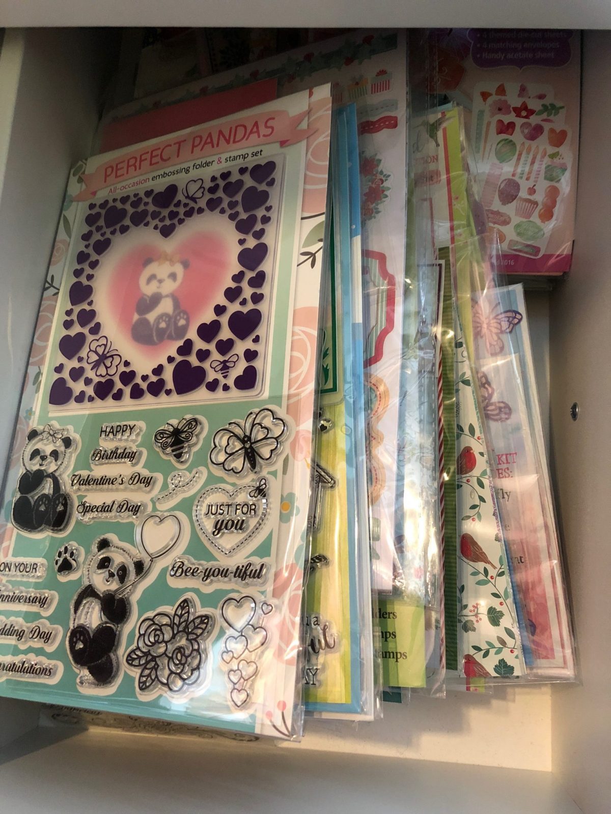 Unused Magazine gifts in a drawer waiting to be tried  Living Creatively with Fibro | Unused Magazine gifts in a drawer waiting to be tried including stamps embossing folders and dies as well as papers