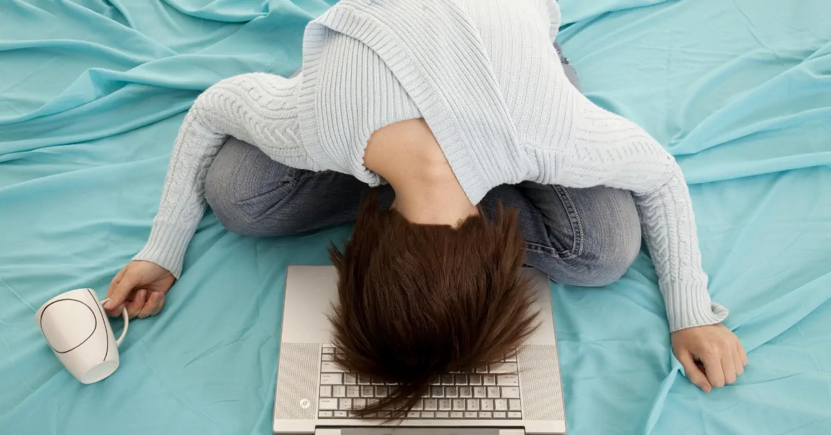 A woman collapsed on her laptop